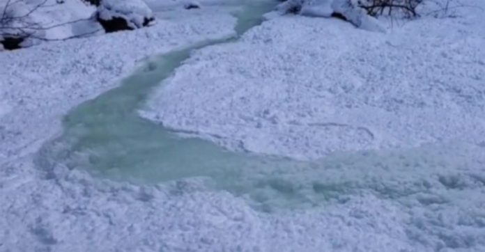 Video of Canadian stream quickly disappearing beneath ice goes viral!